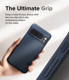 Google Pixel 8 Pro Case | Onyx - Hand holding a dark blue phone case with a textured micro-dot grip pattern on the side.