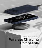 Google Pixel 8 Pro Case | Onyx - Dark blue phone case on a wireless charging pad with a second phone in the background.