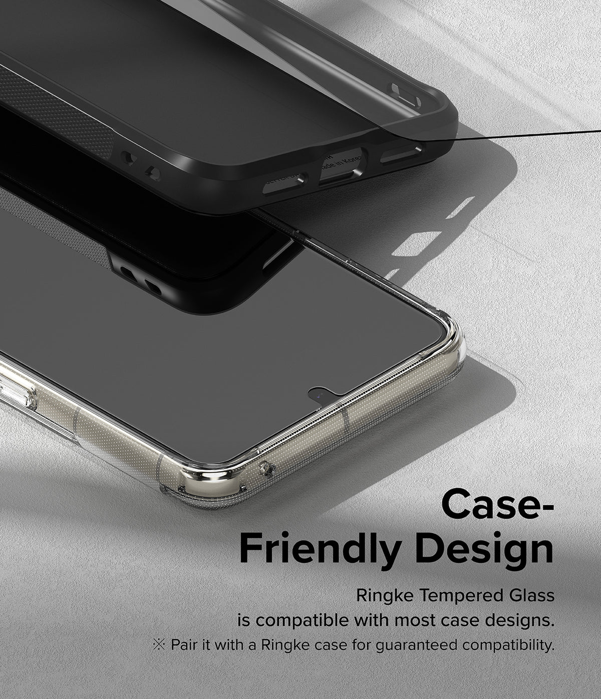 Google Pixel 8 Pro Screen Protector | Glass - Tempered glass screen protector hovering above a smartphone in a case.