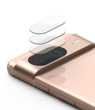 Google Pixel 8 | Camera Protector Glass [3 Pack] - Google Pixel 8 | Camera Protector Glass - Three transparent glass protectors hovering above a rose gold phone camera bar.