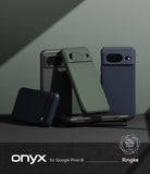 Google Pixel 8 Case | Onyx - Multiple Google Pixel 8 cases in black, green, and blue with textured finishes on a dark surface.