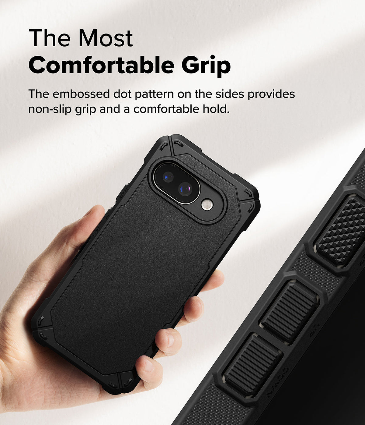 Google Pixel 9a Case | Rugged Gear - Hand holding a black phone case with a textured, non-slip dot pattern on the sides.