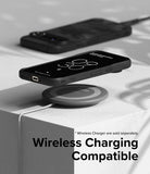 Google Pixel 9 Pro XL Case | Onyx - A black phone case on a wireless charging pad with a second phone in the background.