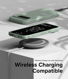 Google Pixel 9 Pro XL Case | Onyx - Sage green phone case on a wireless charging pad with a digital clock display.