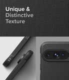 Google Pixel 9 Pro Case | Onyx - Close-up of black textured phone case showing camera cutout and side grip details.