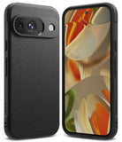 Google Pixel 9 Case | Onyx - Black textured protective case shown from the back and front with an abstract wallpaper.