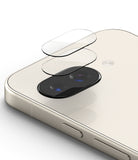 Google Pixel 9a | Camera Glass - Two transparent glass lens protectors hovering above the dual-camera module of a phone.