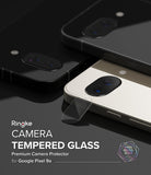 Google Pixel 9a | Camera Glass - Tempered glass protector hovering over the camera lens of a white Pixel 9a smartphone.