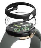 Google Pixel Watch 3 45mm | Slim - Exploded view of a black watch case and clear cover hovering over a smartwatch.