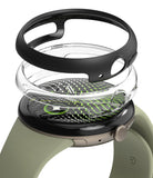 Google Pixel Watch 5 / 4 (45mm) | Slim (2 Pack) - A smartwatch with a light olive green strap, black bezel, and a transparent protective ring cover with a green patterned inner layer, shown on a clean white background.
