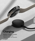Google Pixel Watch 41mm | Bezel Styling - A Pixel Watch with a protective bezel case hovering above a wireless charging puck.