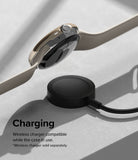 Google Pixel Watch 41mm | Bezel Styling - A gold-cased Pixel Watch hovering above a black wireless charging puck.