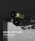 Google Pixel Watch 41mm | Premium Bezel Styling - Two Google Pixel watches with different bezel covers and bands on a concrete surface.
