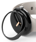 Google Pixel Watch 41mm | Bezel Styling - A glossy black protective bezel cover hovering over a black Pixel Watch.