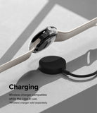 Google Pixel Watch Case | Slim - A clear protective case on a Pixel Watch resting on a wireless charging puck.