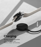 Google Pixel Watch Case | Slim - A Pixel Watch with a clear slim case hovering above a black wireless charging puck.