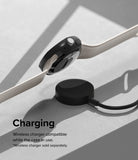 Google Pixel Watch Case | Slim Edge - Black protective case on a Pixel Watch charging wirelessly on a puck.