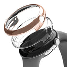 Google Pixel Watch Case | Slim - Rose gold slim protective case hovering above a black Google Pixel Watch.