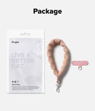 Holder Link Puffer | Hand - Ringke branded packaging next to a pink puffer hand strap and a small metal ring attachment.