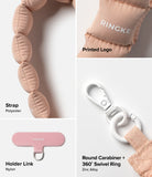 Holder Link Puffer | Hand - Pink quilted polyester strap, nylon holder link, and white zinc alloy swivel carabiner.