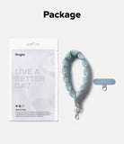 Holder Link Puffer | Hand - Light blue puffer hand strap with a matching adhesive anchor tab and Ringke retail packaging.