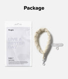 Holder Link Puffer | Hand - Cream-colored quilted puffer hand strap with a white clip and a Ringke phone tether tab.