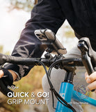 Quick & Go | Grip Bike Mount - Smartphone secured to bicycle handlebars with a black rubber strap mount.