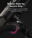 Quick & Go | Grip Bike Mount - Close-up of a bike mount with a pink rubber pad securing the clamp to a handlebar.