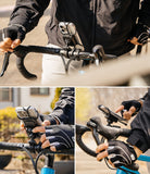 Quick & Go | Grip Bike Mount - Cyclist using a phone mount on handlebars with elastic straps securing the device in place.