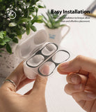 Ringke Airpods Pro Dust Guard Sticker - Hands applying a black adhesive dust guard to an open AirPods Pro charging case.
