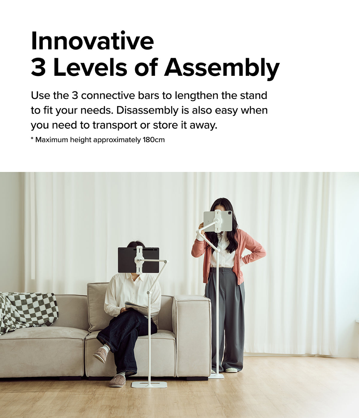 Ringke Stand Floor Holder - Two white adjustable floor stands holding tablets at different heights in a living room.