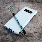 Paracord Lanyard Wrist Strap [2 Pack] - Blue and black woven paracord wrist strap attached to a light blue phone case.