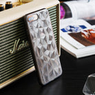 iPhone 8 Plus / 7 Plus Case | Air Prism - Glittery, geometric prism-patterned phone case leaning against a vintage speaker.