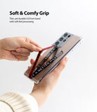 Ringke Strap Band - Hands holding a phone with a clear case and a red fabric strap printed with "LIVE A BETTER DAY".
