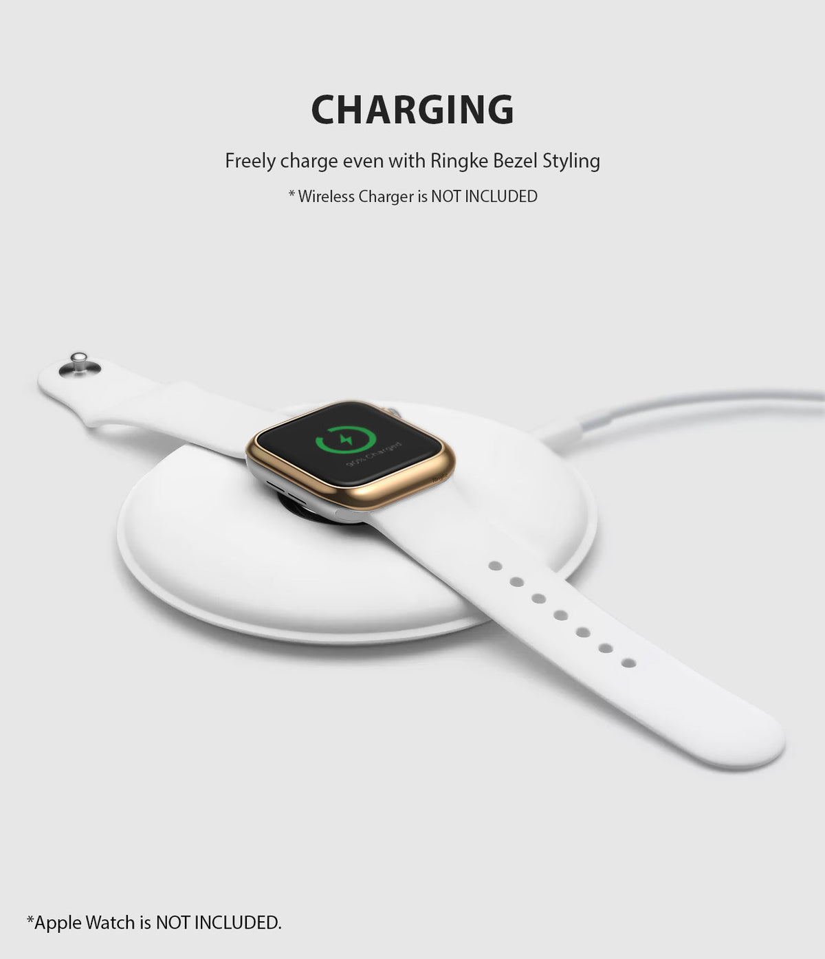 Apple Watch 3 / 2 / 1 (42mm) | Bezel Styling - Apple Watch with gold bezel styling charging on a white wireless pad.