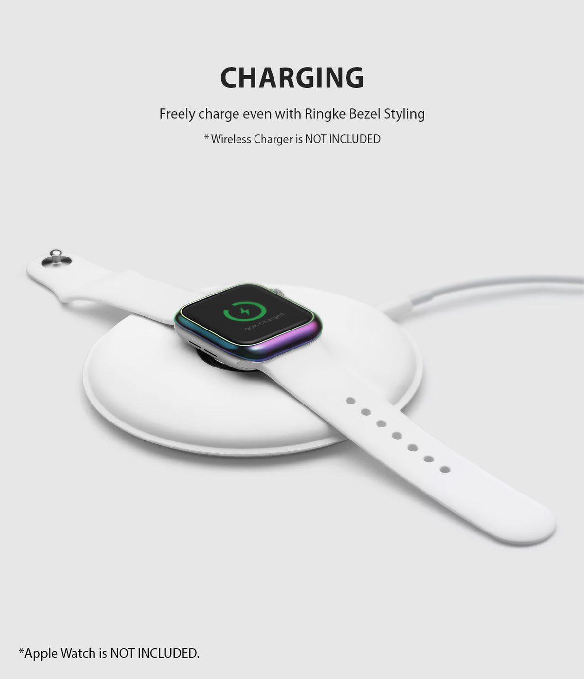 Apple Watch 3 / 2 / 1 (42mm) | Bezel Styling - Apple Watch with iridescent bezel ring charging on a white wireless pad.