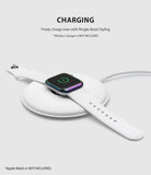 Apple Watch 3 / 2 / 1 (42mm) | Bezel Styling - Apple Watch with iridescent bezel ring charging on a white wireless pad.