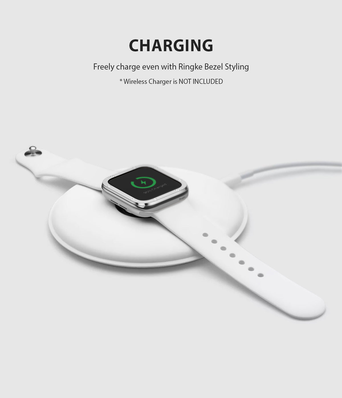 Apple Watch Series 3 / 2 / 1 (42mm) | Premium Bezel Styling H - Apple Watch with silver bezel styling charging on a pad.