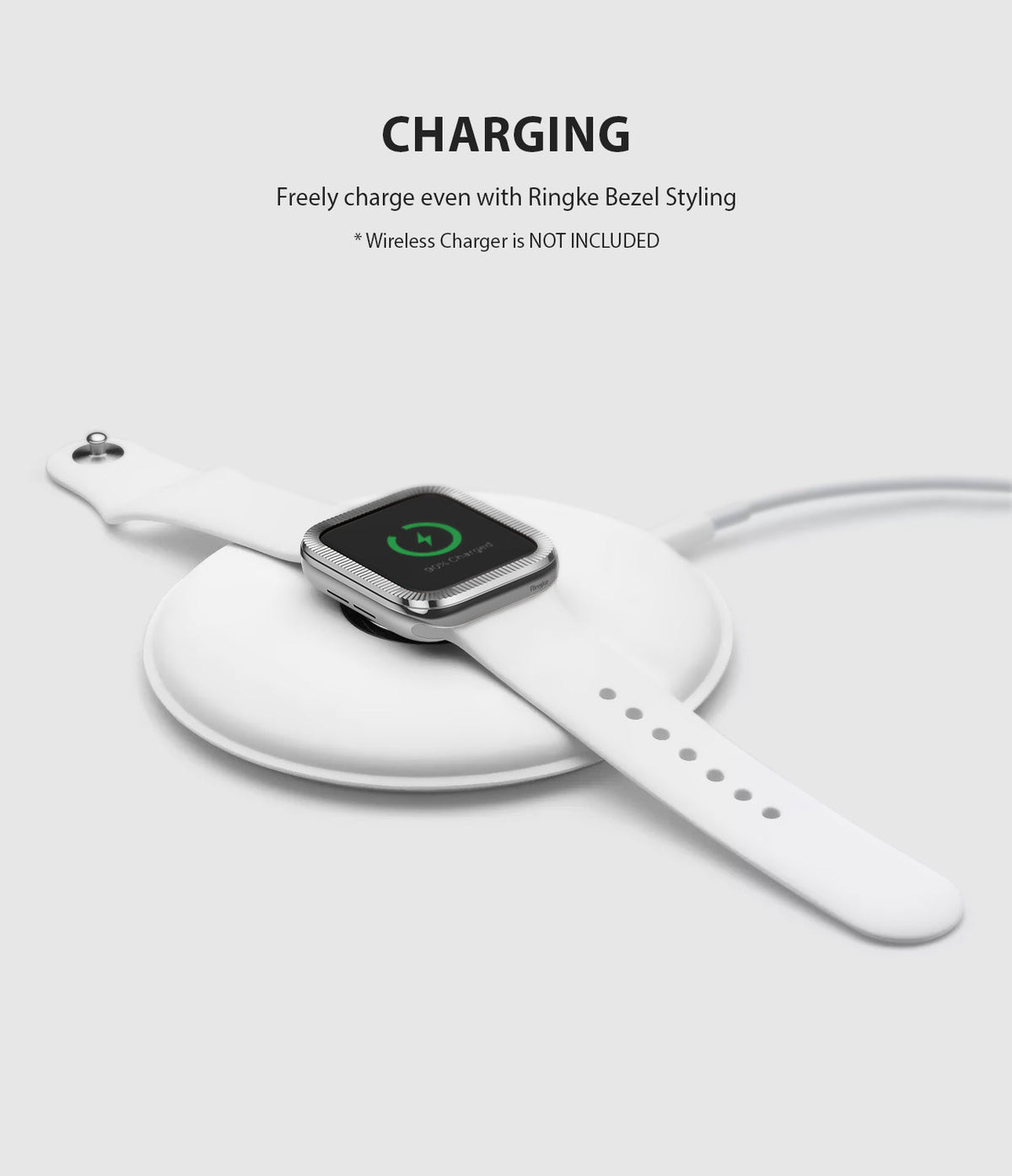 Apple Watch Series 3 / 2 / 1 (42mm) | Premium Bezel Styling O - Apple Watch with silver bezel styling charging on a pad.