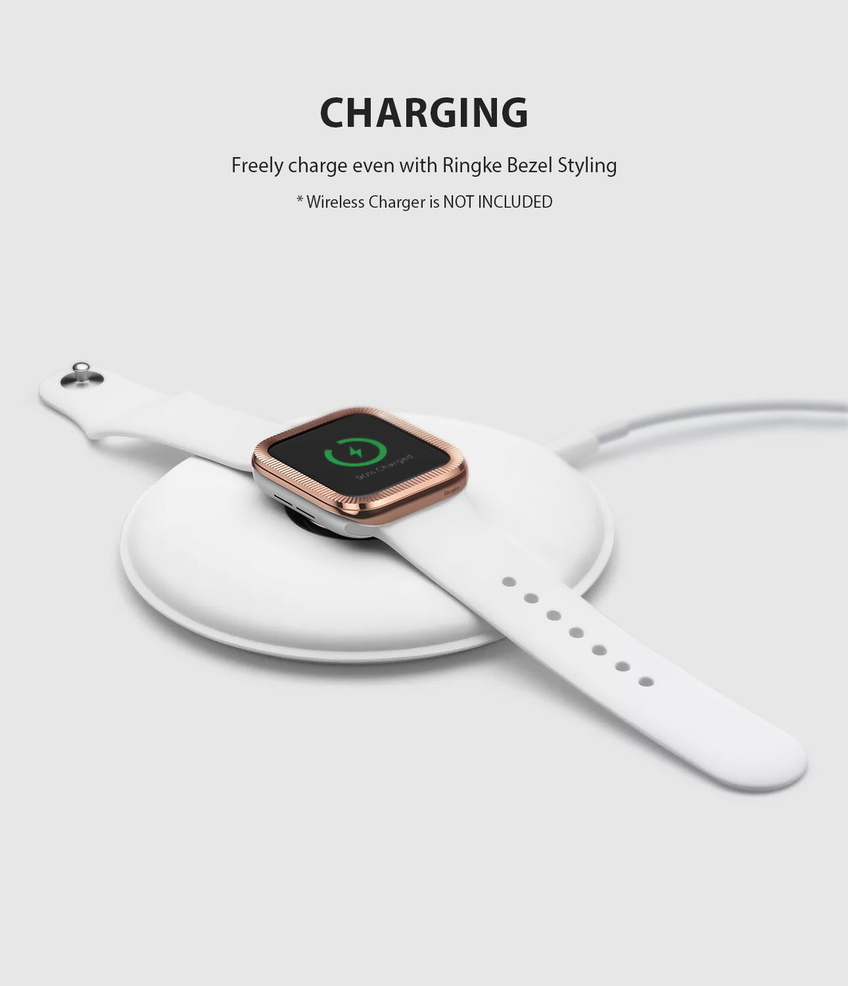 Apple Watch Series 3 / 2 / 1 (42mm) | Premium Bezel Styling O - White Apple Watch with rose gold bezel charging on a pad.