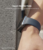 Apple Watch 3 / 2 / 1 (42mm) | Bezel Styling - Close-up of an Apple Watch with a metallic bezel protector against a concrete wall.