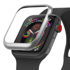 Apple Watch 3 / 2 / 1 (42mm) | Bezel Styling - A silver metallic bezel accessory hovering above a black Apple Watch.