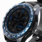 Galaxy Watch (42mm) | Bezel Styling - A blue tachymeter bezel cover on a black smartwatch with a matching blue digital watch face.