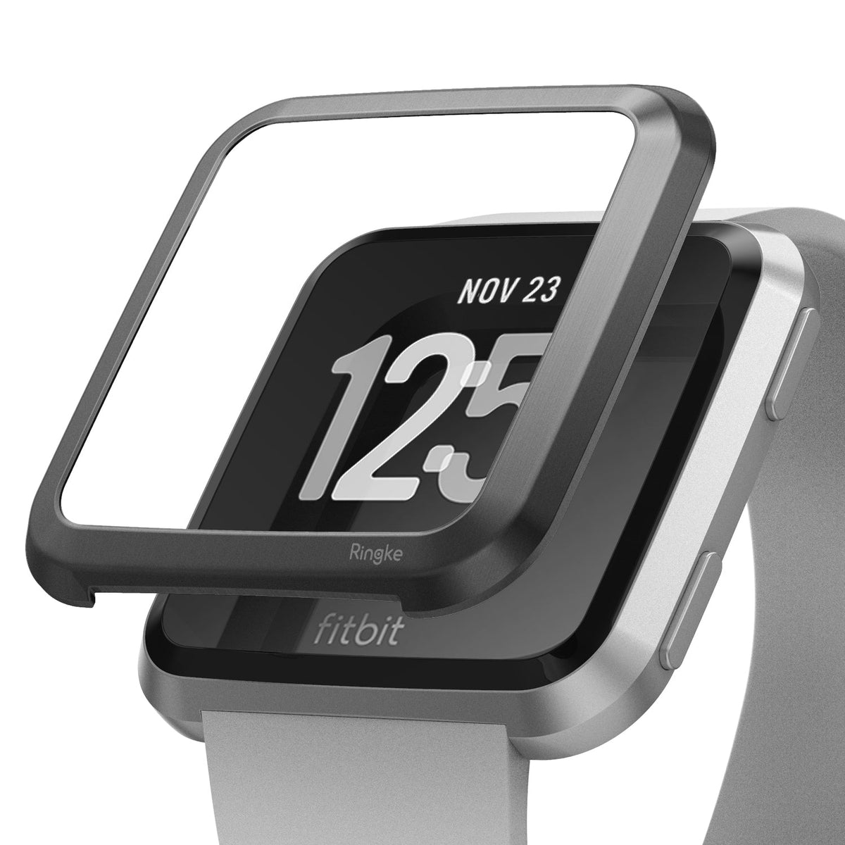 Fitbit Versa | Bezel Styling 06 - A black metal bezel accessory hovering above a silver Fitbit Versa smartwatch.