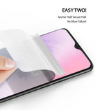 OnePlus 7 Screen Protector | Dual Easy Film - OnePlus 7 Screen Protector - Hand applying a dual-layer screen protector film onto a smartphone screen.