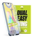 Galaxy M31 Screen Protector | Dual Easy Film - Galaxy M31 Screen Protector - Ringke Dual Easy Wing film being applied to a Galaxy M31 phone next to its lime green packaging.