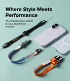 Dual Hand Slim Strap - Three colorful phone straps with adjustable buckles and loops next to two smartphones on a green background.