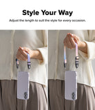 Dual Hand Slim Strap - Person demonstrating adjustable length of a pastel gradient phone wrist strap on a clear case.