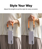 Dual Hand Slim Strap - Person holding a phone with an adjustable orange wrist strap at two different lengths.