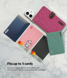 Card Holder | Flip [2 Pack] - Pink fabric flip card holder on a smartphone with four credit cards displayed on marble.